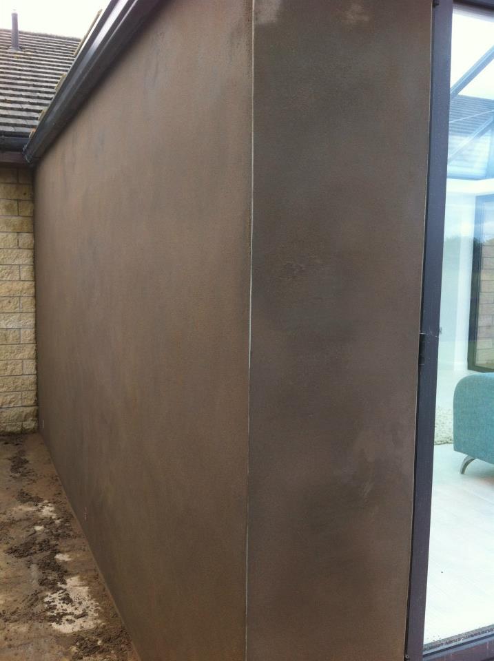 581356_439073379490322_793307860_n Corner edge of freshly plastered wall