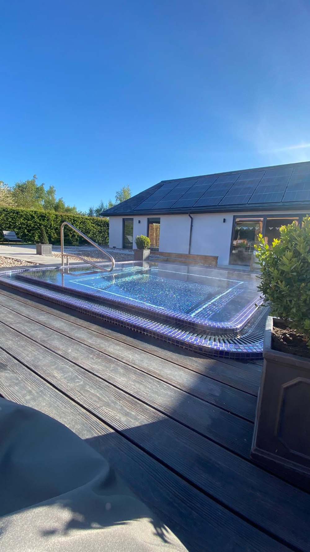 Extension of house with solar panels and hot tub