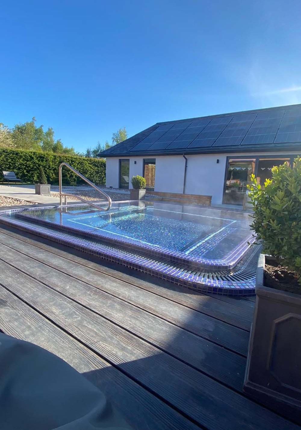 Extension of house with solar panels and hot tub