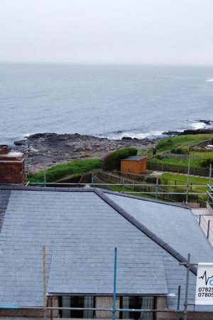 Birds eye view of new roof on house at the coast
